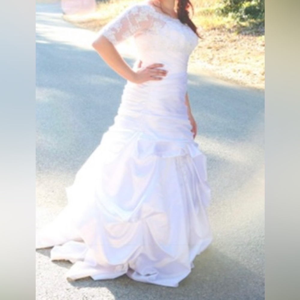 Paid$ 1200 asking $700 OBO, Professionally cleaned, strapless, had top over it.